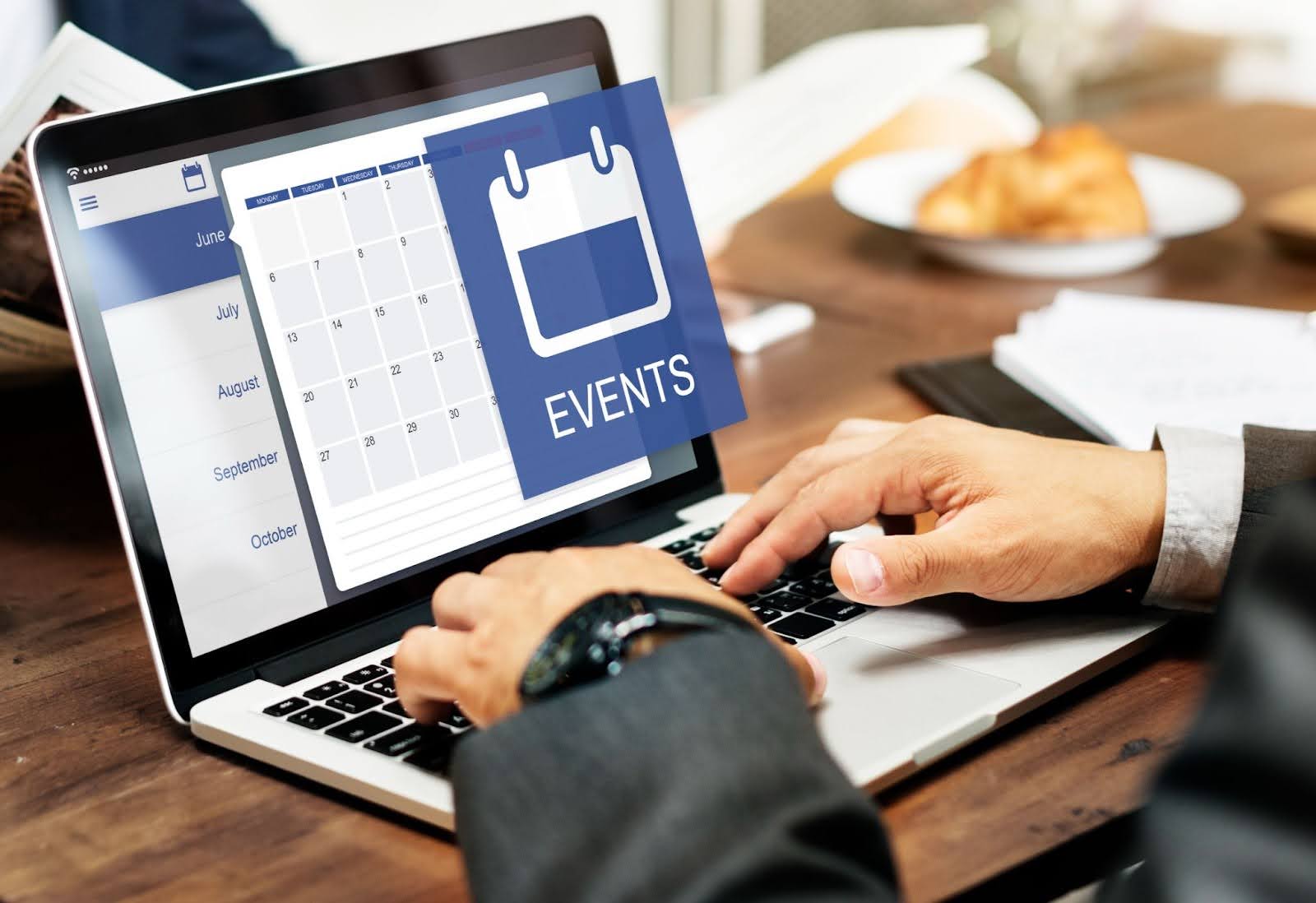 A Person Using Calendar on Laptop - How to Forward iPhone Calendar Events to Google Calendar